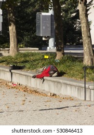 Man Sleeping On Wall In War Memorial Plaza