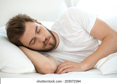 Man Sleeping On White Bad