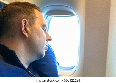 Man Sleeping Onboard During The Long Flight