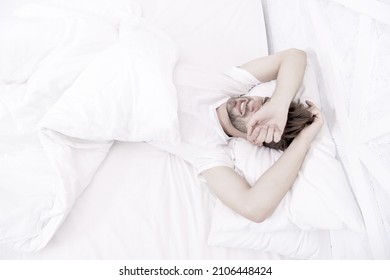 Man Sleeping White Bedroom. Cosy Weekend At Home. Time To Relax. Guy Had Sleepless Night. Male Health Concept. Peacefulness Concept. Tired Man Sleep In Bed. Early Morning Wakeup