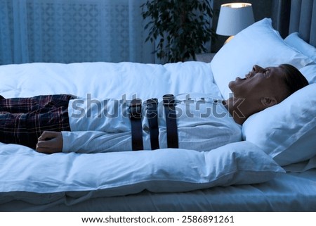 Man in sleepwalking condition screaming on bed