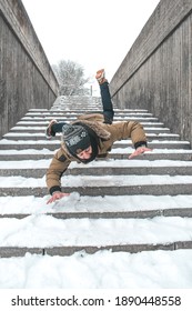 Man Slip On Ice And Is Falling Down The Stairs