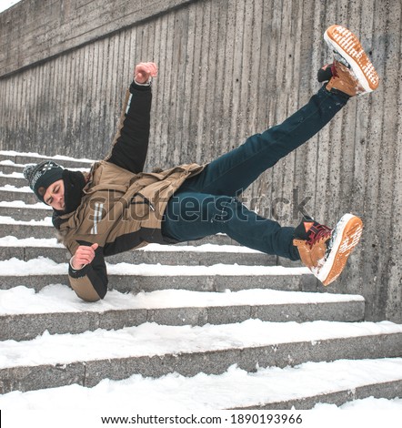 Man slipped and falling a stairs in winter