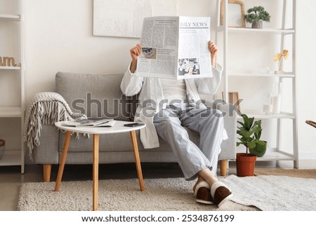 Similar – Image, Stock Photo Relaxed reading newspaper by the pool