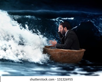 Man In Small Boat Of Walnut In A Storm