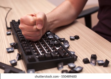 Man Smashes A Mechanical Computer Keyboard In Rage Using One Fist