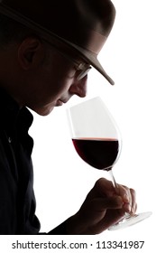 Man smelling a glass of red wine