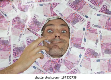 Man Smoking A 500 Euro Note