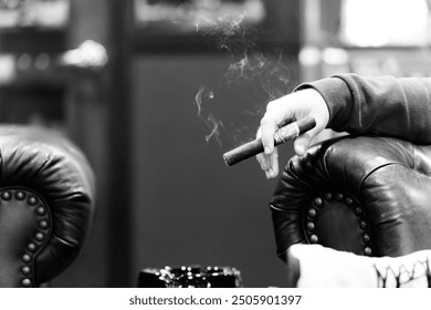 Man smoking a cigar in a lounge