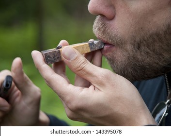 Man Smoking Marijuana Pipe