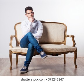 man smoking on a sofa - Shutterstock ID 373246147