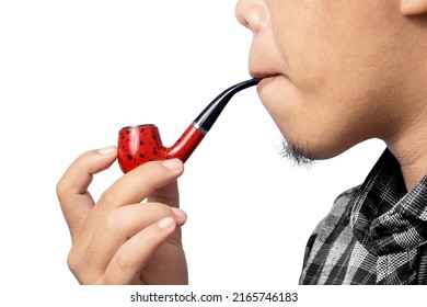man smoking using a pipe