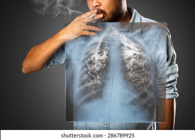 Man smoking with x-ray lung, Isolated on grey background