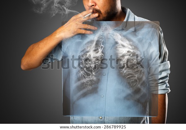 Man\
smoking with x-ray lung, Isolated on grey\
background