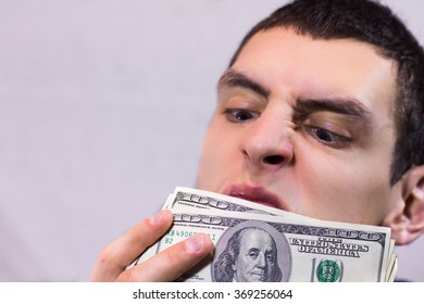 Man Sniffing Dollars