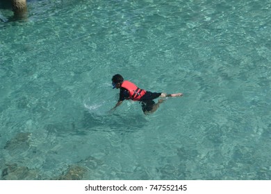 A man snorkeling at "Perhentian" island