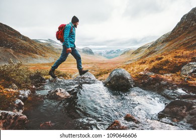 Man solo traveling backpacker hiking in scandinavian mountains active healthy lifestyle adventure journey vacations - Shutterstock ID 1090646606