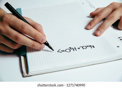 The man solves the chemistry task. Science of chemistry and exact sciences. The concept of solving complicated physical and chemical tasks.