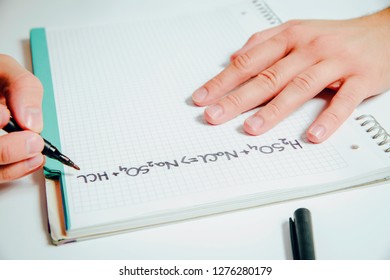 The man solves the chemistry task. Science of chemistry and exact sciences. The concept of solving complicated physical and chemical tasks.
