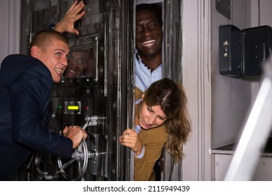 Man Solving Puzzles To Get Out Of Horror Style Escape Room