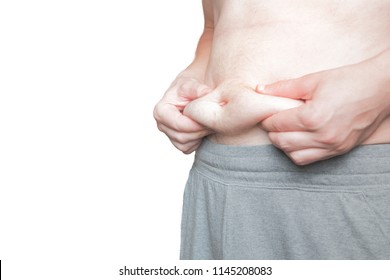 Man With Sport Shorts Pulls His Belly Fat, Body Isolated To Use A Custom Background