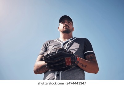 Man, sports and baseball outdoor with glove for playing game, exercise or club competition on field. Player, determined and softball athlete in stadium with training, low angle and blue sky for pitch - Powered by Shutterstock