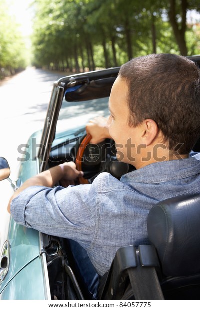 Man in sports\
car