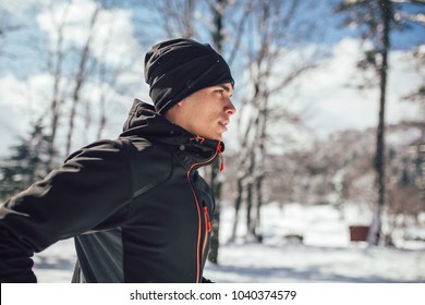 Man Sportsman Taking Break From Running in Extreme Snow Conditions - Powered by Shutterstock