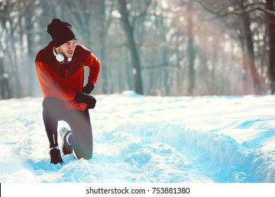 Man Sportsman Taking Break From Running in Extreme Snow Conditions - Powered by Shutterstock