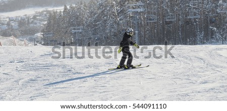 Man in sportswear skiing and are going to the mountains in winter.
