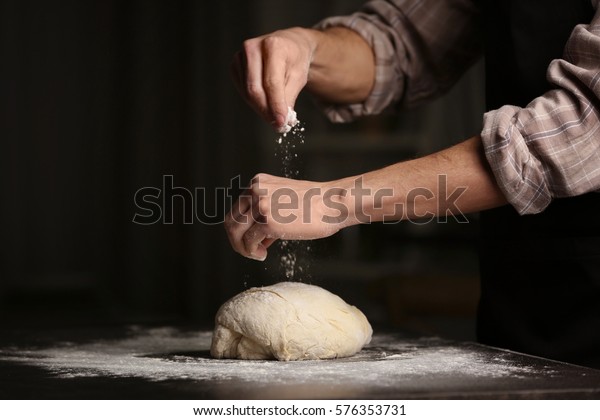 Man Sprinkling Flour Over Fresh Dough Stock Photo (Edit Now) 576353731