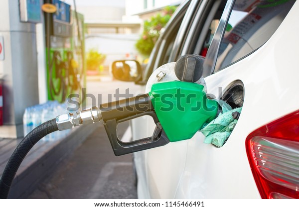 Man staff oil or
gas station using energy for car or transportation, automobile,
automotive, refuel, image