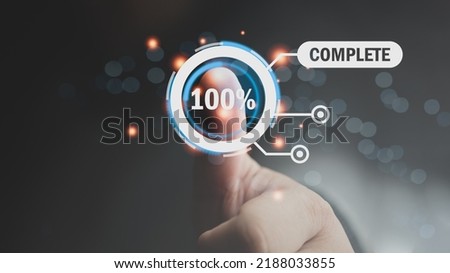Man stamp on screen of project complete 100 percent. Conceptual photo of success to work