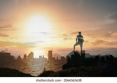 Man Standing Above The Clouds Looking Out To The City. 