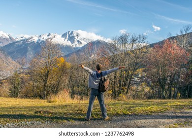 man standing against the mountains