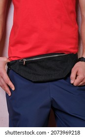 Man Standing With A Black Small Fanny Bag