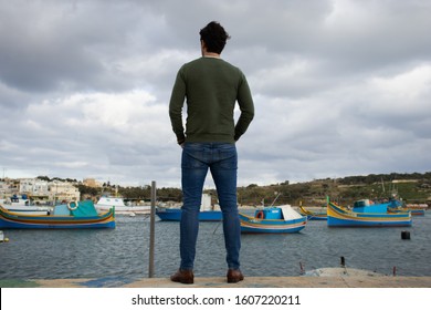 man standing by the harbour - Powered by Shutterstock