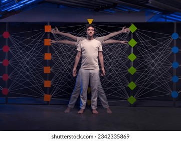 Man standing in front of schematic visualisation of artificial neural network. Superimposed arms connecting nodes. Reference to the Vitruvian Man. Concept of artificial intelligence, machine learning