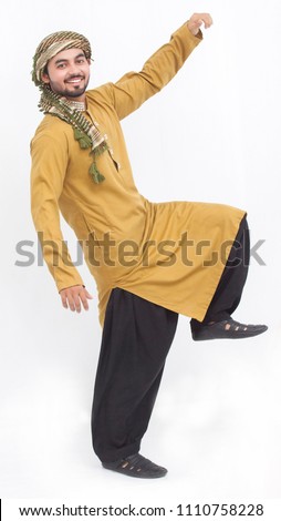 Man standing and hand up like a super boy and trying to fly, wearing kameez shalwar. Eid look. isolated on white background Eid mubarak offer.