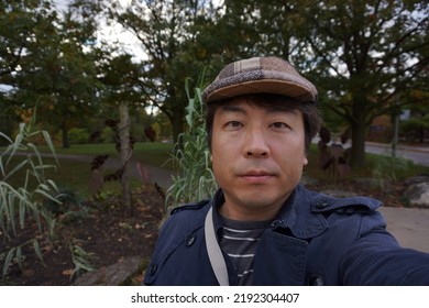 A Man Standing At High Park In Bloor Street West In Toronto City Of Ontario, Canada