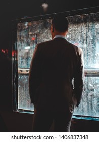 Man standing infront of window