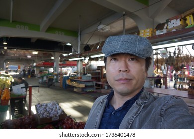 A Man Standing At Marche Jean Talon In Montreal City Of Quebec, Canada