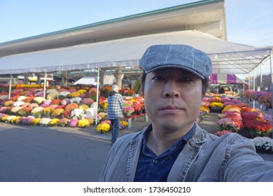 A Man Standing At Marche Jean Talon In Montreal City Of Quebec, Canada