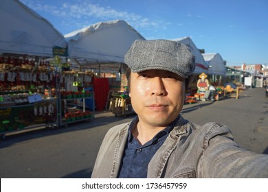 A Man Standing At Marche Jean Talon In Montreal City Of Quebec, Canada