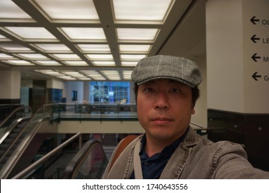 A Man Standing At Montreal Underground City In Centre Eaton De Montreal Area Of Quebec, Canada