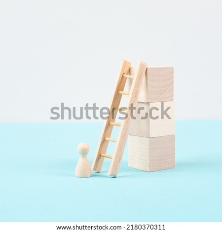 Man is standing next to a ladder, climbing up in career, having a goal, brainstorming for ideas, success strategy, taking a challenge, business concept