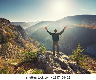Man standing on the cliff. Conceptual scene. Mountain nature composition. 
