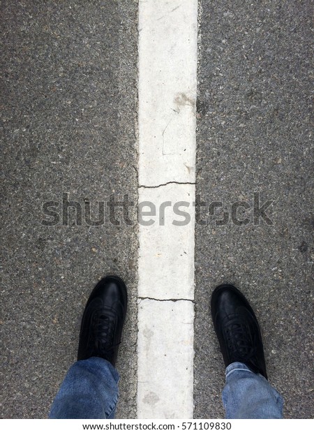 Man Standing On The
Dividing Line