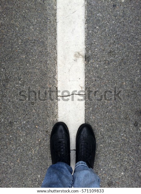 Man Standing On The
Dividing Line