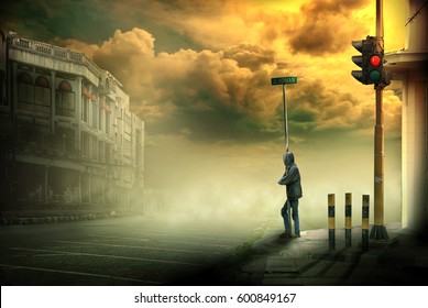 a man standing on the edge of a quiet street in a town with a background fog and buildings - Powered by Shutterstock